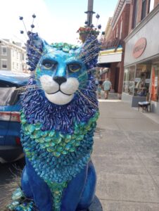 A cat statue on Main Street in the Village of Catskill.]