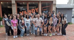Summer interns pose outside The Vandy in downtown Albany mid-historic tour
