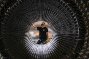 A Schenectady manufacturing employee inspects a generator. Courtesy GE Vernova